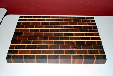 Brick Wall Cutting Board by Karen Sheldon - Walnut, Maple Cherry Brick Wall Cutting Board by Karen Sheldon